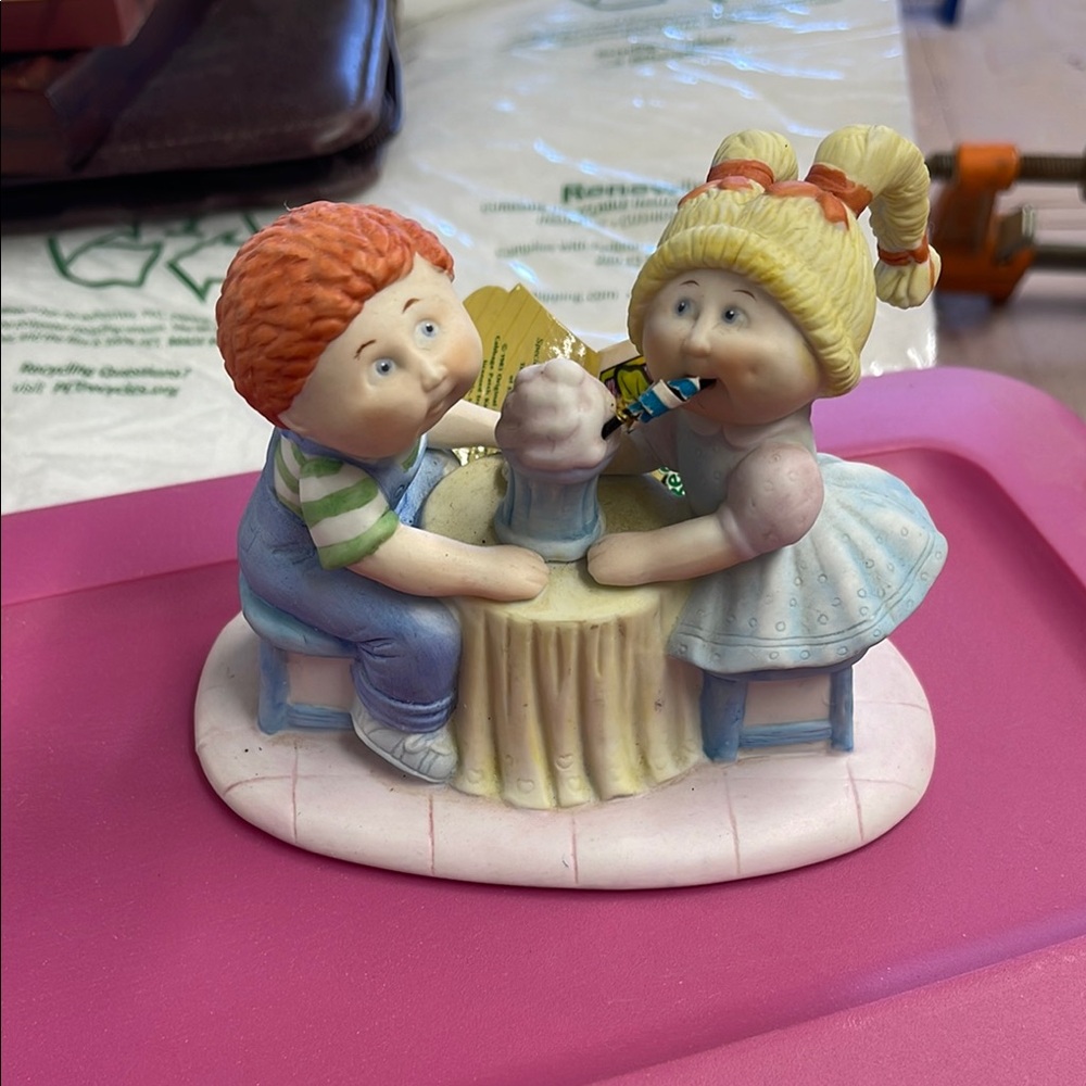 Charming Figurine with Boy and Girl Sharing a Milkshake